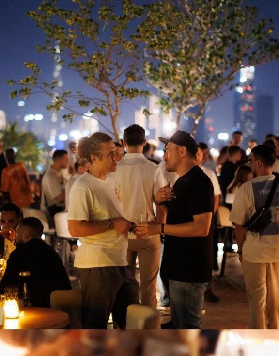Guests on a rooftop at night